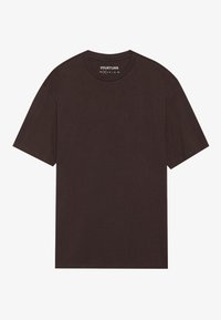 Brūns, īsām piedurknēm T-krekls, kas izgatavots no mīksta kokvilnas auduma. Apaļš kakla izgriezums ar minimālām šuvēm. Nav redzamas nekādas rakstu vai akcentu.