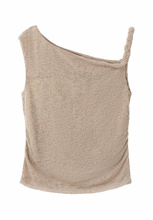 Haut sans manches beige texturé avec une bretelle sur une épaule et l'autre bretelle manquante ou stylisée de façon asymétrique.