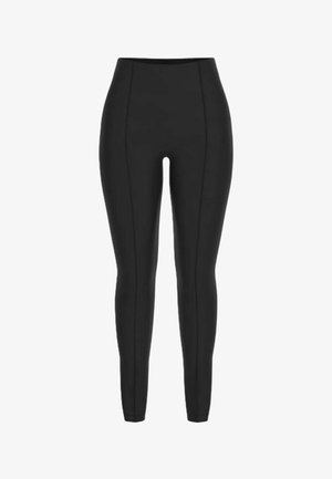 Leggings neri a vita alta e taglio skinny con cuciture verticali visibili che scorrono lungo la parte anteriore di entrambe le gambe.