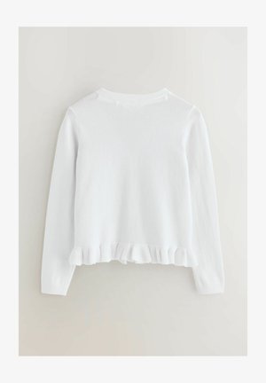 Biely pletený sveter s dlhými rukávmi, okrúhlym výstrihom a volánovým lemovaním. Mäkká textúra a rovnomerné stehy po celom povrchu.