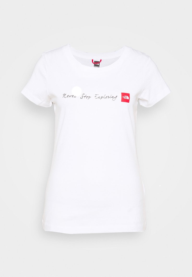 White cotton T-shirt with a round neckline. Features "Never Stop Exploring" text in black script and a small red logo patch. Short sleeves.