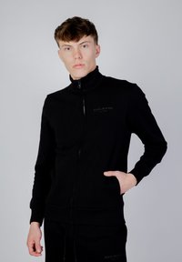 GAS LUSTIG POCKET - Sweater met rits - black