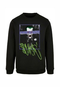 Must ametri musta sweatshirt, millel on graafiline trükk tegelase näost, kellel on rohelised juuksed. Kaunistatud lillaka ja neoonrohelise kujundusega. Ümar kaelus.
