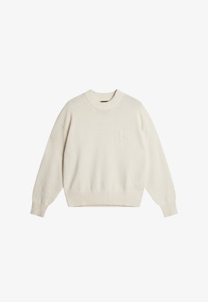 Maglione color crema con colletto rotondo a costine, spalle scese e orlo a costine. Presenta un logo sottile ricamato sul davanti.