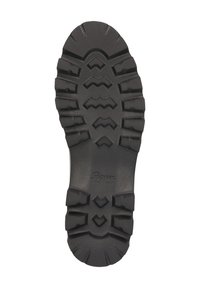 Schwarze Gummistiefelsohle mit tiefen, robusten Profilen und dem eingeprägten Markennamen "Sioux" nahe der Ferse.