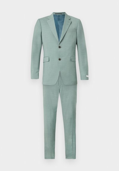 Hellgrüner Anzug aus strukturiertem Stoff, bestehend aus einem Zweiknopfjackett mit spitzem Revers und passender Hose. Kontrastierendes blaues Futter innen.