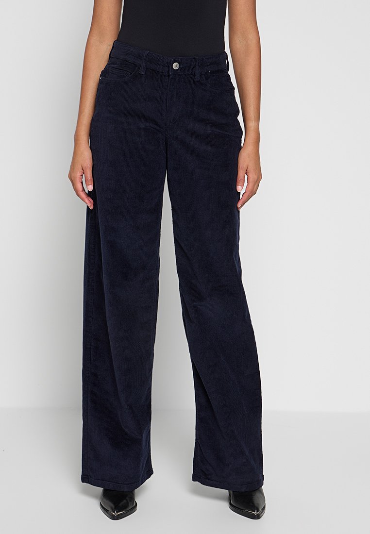 Marineblaue Cord-Hosen mit weitem Bein und hoher Taille, mit vorderen Taschen, einem Knopfverschluss und einem weichen, strukturierten Stoff.