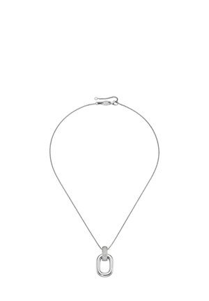 Silver chain necklace with an oval pendant. Pendant features a central element outlined by a smooth, shiny frame and a textured band.
