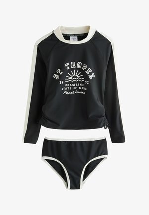 Czarna koszulka rash guard z długim rękawem z białym wykończeniem i dopasowanym dołem bikini, z tekstem „St Tropez Coastline State of Mind French Riviera” i grafiką słońca.