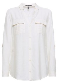 Chemise à manches longues crème clair en tissu texturé, dotée de deux poches poitrine, d'une fermeture à boutons à l'avant et de pattes pour manches retroussées.