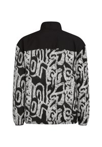 Veste en polaire avec une section supérieure noire et une section inférieure grise à motifs comportant des designs abstraits noirs. Manches longues et col haut.