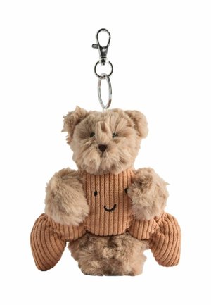 Plüsch-Teddybär-Schlüsselanhänger, der ein lächelndes braunes Cord-Herz hält, mit einem Metallverschluss und Schlüsselring oben befestigt.