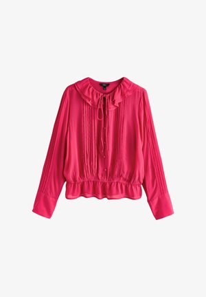 Růžová halenka se zavinovacím límcem, zapínáním na knoflíky a řaseným předním dílem. Dlouhé rukávy s elastickými manžetami, elastický pas a hladká textura.