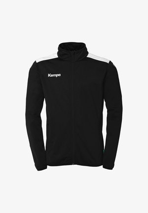 Schwarze Zip-Jacke mit hohem Kragen, weißen Schulterakzenten und dem "Kempa"-Logo auf der linken Brust. Verfügt über seitliche Taschen.