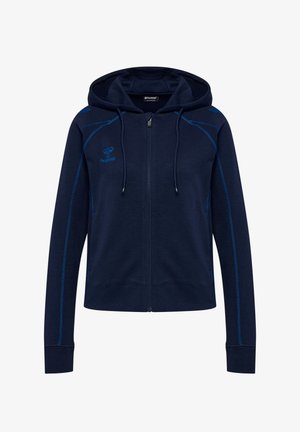 Marineblå lynlåshættetrøje med hætte, lange ærmer, blå syningsdetaljer og lille logo på venstre bryst og højre skulder.
