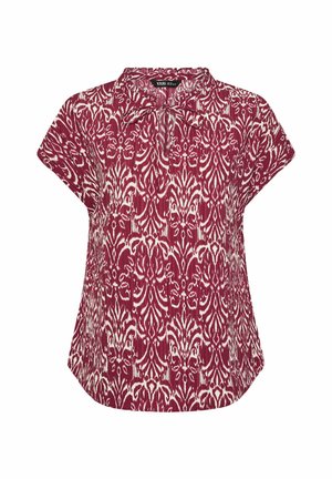 Kurzärmeliges, kastanienbraunes Oberteil mit weißem abstraktem Blumenmuster und kleiner Schleife am Kragen, locker sitzend mit abgerundetem Saum.