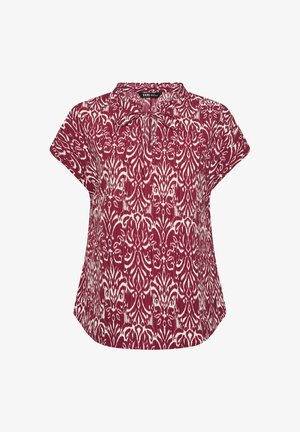 Kortermige bordeauxrode blouse met wit abstract bloemenpatroon en een klein strikje bij de kraag, losse pasvorm en afgeronde zoom.