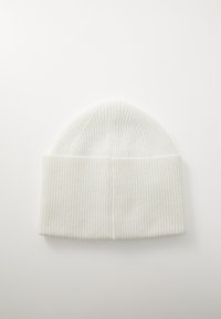 White knit beanie hat featuring vertical ribbed texture and a rolled cuff. Durable fabric with a soft finish.