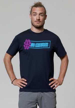 Navy blue cotton t-shirt featuring a bold neon graphic with the text "#NO EXCUSES" in pink and blue. Crew neck and short sleeves.