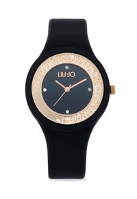 Orologio in silicone nero con quadrante rotondo, accenti color oro e una lunetta decorata con cristalli. Presenta un quadrante scuro con lancette e indici in oro rosa.