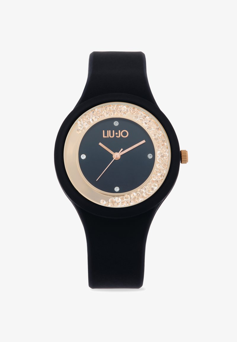 Schwarze Silikon-Uhr mit rundem Ziffernblatt, goldfarbenen Akzenten und einem mit Kristallen besetzten Gehäuse. Verfügt über ein dunkles Zifferblatt mit roségoldenen Zeigern und Indizes.
