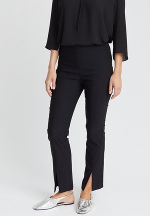 EVERLY - Trousers - black