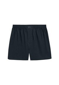 Boxers bleu marine foncé en tissu doux, avec une taille élastique, deux boutons de fermeture et un plastron avant unique.