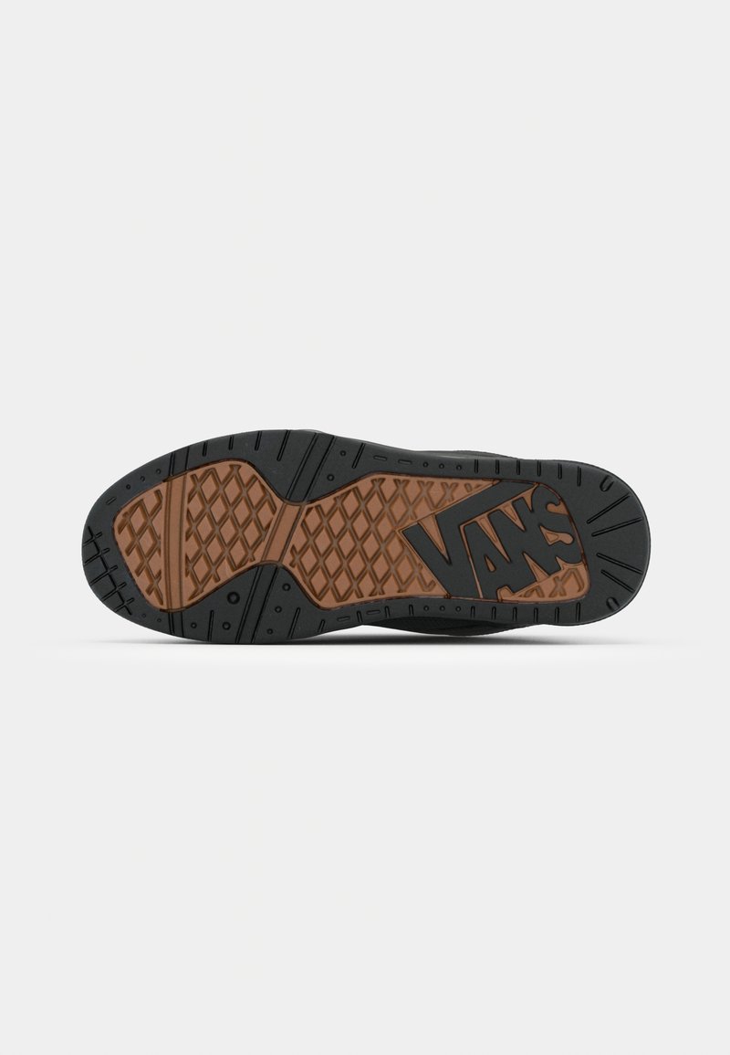 Podeszwa sneakerów Vans z czarnym gumowym wykończeniem i brązowymi, teksturowanymi akcentami. Posiada sześciokątny wzór oraz widoczne logo marki.