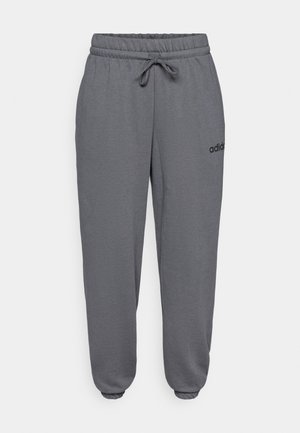 Sivé teplákové nohavice s elastickým pásom, sťahovacou šnúrkou a elastickými manžetami, s malým čiernym logom na ľavej strane.