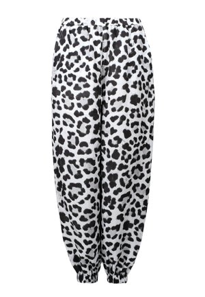 Jogginghosen mit Leopardenmuster, die ein schwarz-weißes Design aufweisen, einen elastischen Bund und geraffte Bündchen an den Knöcheln haben. Weiche Stofftextur.