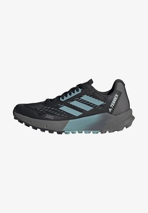 Black trail running shoe with a mesh upper, light blue accents, and a textured rubber sole for traction. Features a supportive heel and reinforced toe.