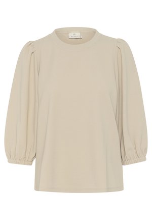 Blusa de manga abullonada color beige, hecha de una tela suave, con cuello redondo y puños elásticos para un ajuste relajado. Textura suave, diseño desestructurado.