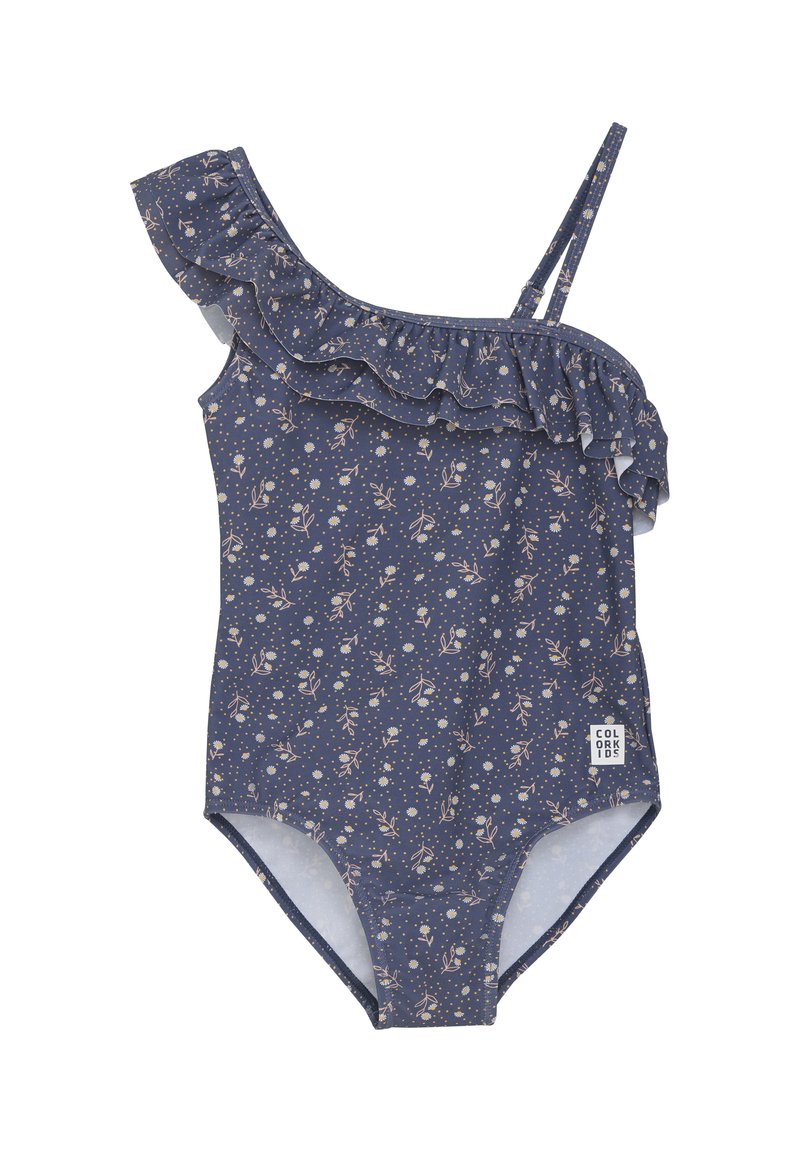 Enbitar med enbitar i mörkblått med blommönster. Har en asymmetrisk volang på vänster axel och justerbara remmar. Märkesetikett på sidan.