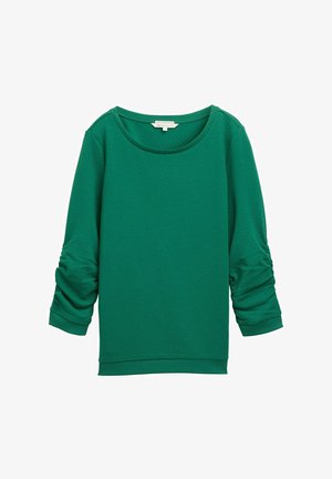 Zaļš struktūrēts krekls ar garām, ručotaām piedurknēm, apaļu kakla izgriezumu un ribotām aprocēm. Augstas kvalitātes, mīksta auduma apdare.