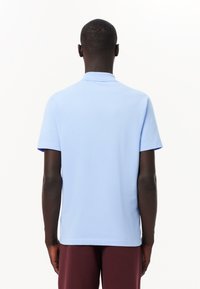 Lacoste HOMME - Polo - bleu pastel hbp