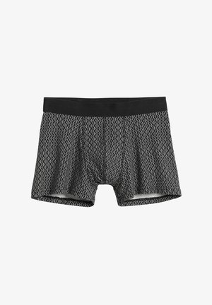 Musta, geometrisellä valkoisella kuviolla koristellut bokserishortsit, joissa on joustava vyötärönauha mukavuutta varten ja pehmeä tuntuma.