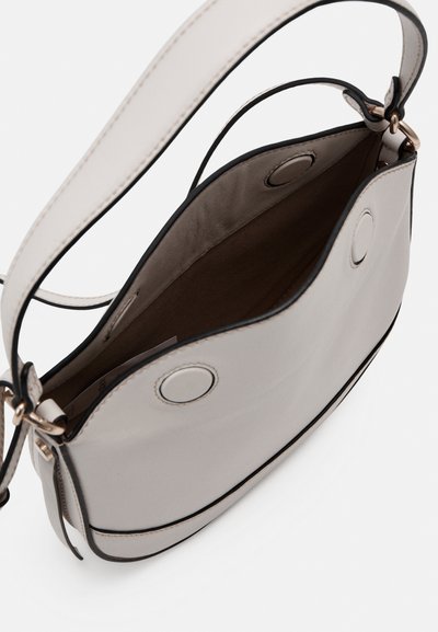 Gray synthetic handbag with a smooth finish, featuring black trim and two circular hardware accents. Interior is tan and unstructured.