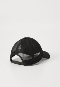 Black cap featuring a solid front, mesh back, adjustable strap, and curved bill. Lightweight fabric with a smooth texture and no patterns.