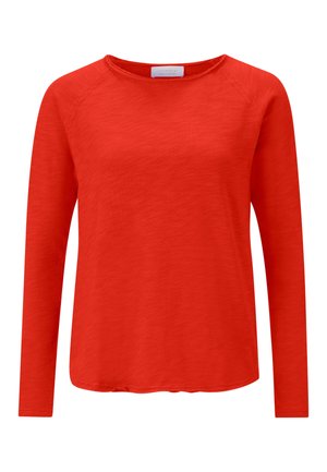 Hosszú ujjú, textúrált anyagból készült piros felső, kerek nyakkivágással és laza szabással, ívelt aljjal. Nincs látható kiegészítő vagy minta.