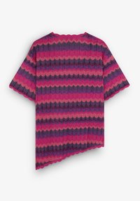Short-sleeve top in pink, purple, and burgundy zigzag pattern. Ribbed texture with scalloped edges, asymmetric hemline.