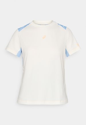 Lightweight short-sleeve t-shirt in cream with blue shoulder panels. Features orange logo on the chest and contrasting stitching details.