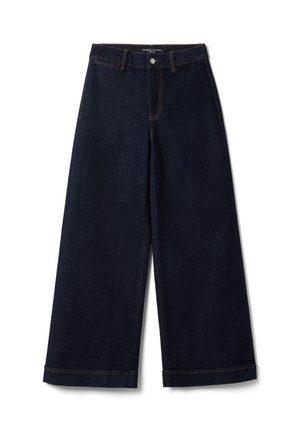 Donkerblauwe denim broek met brede pijpen, riemlussen, knoop aan de voorkant, ritssluiting en zichtbare oranje stiksel details.