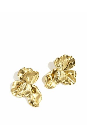 Two shiny gold metal earrings shaped like abstract flower petals on a white background.