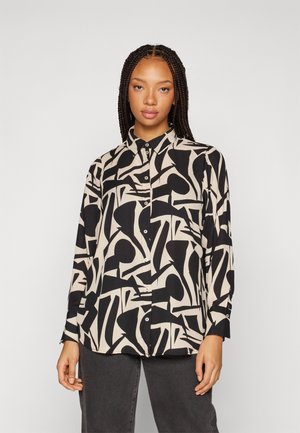 Camicia a maniche lunghe con un motivo astratto nero e crema, colletto e bottoni frontali. Realizzata in un tessuto morbido.