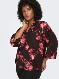 Black blouse with a floral pattern in pink and red, featuring three-quarter sleeves and a V-neckline, made from a lightweight fabric.