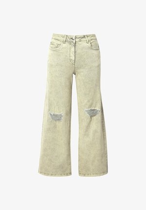 Světle béžové džíny s širokými nohavicemi vyrobené z denimu, s odřenými dírami na přední straně, pěti kapsami a zapínáním na knoflík v pase.