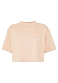 Kraftig kortärmad t-shirt i mjuk persikofärg. Har en hög halsringning och en broderad Nike-logotyp på vänster bröst.