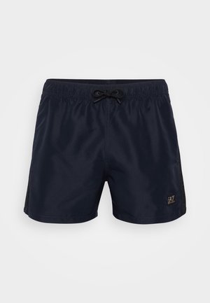 Námorné plavkové šortky s elastickým pásom, šnúrkou na stiahnutie a sieťovými bočnými panelmi. Na prednej dolnej pravej strane sa nachádza malé logo značky.