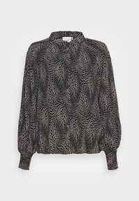 Mustavalkoinen kuviollinen paita, jossa on kaulus, nappikiinnitys edessä ja puffihihat. Valmistettu kevyestä kankaasta, jossa on virtaava rakenne.