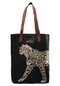 Sac fourre-tout en tissu noir avec des sangles en cuir marron, ornée d'un motif léopard en sequins dorés sur un côté.